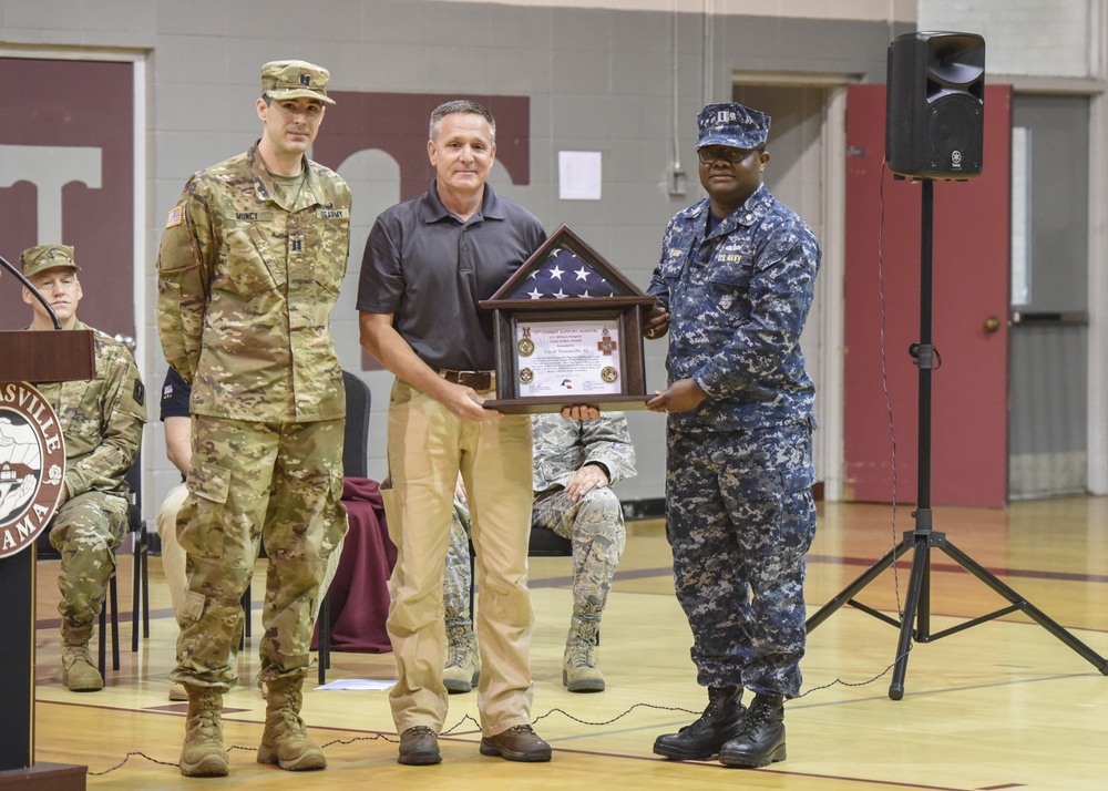 Kevin Heartsill is presented an award at Alabama IRT closing ceremony