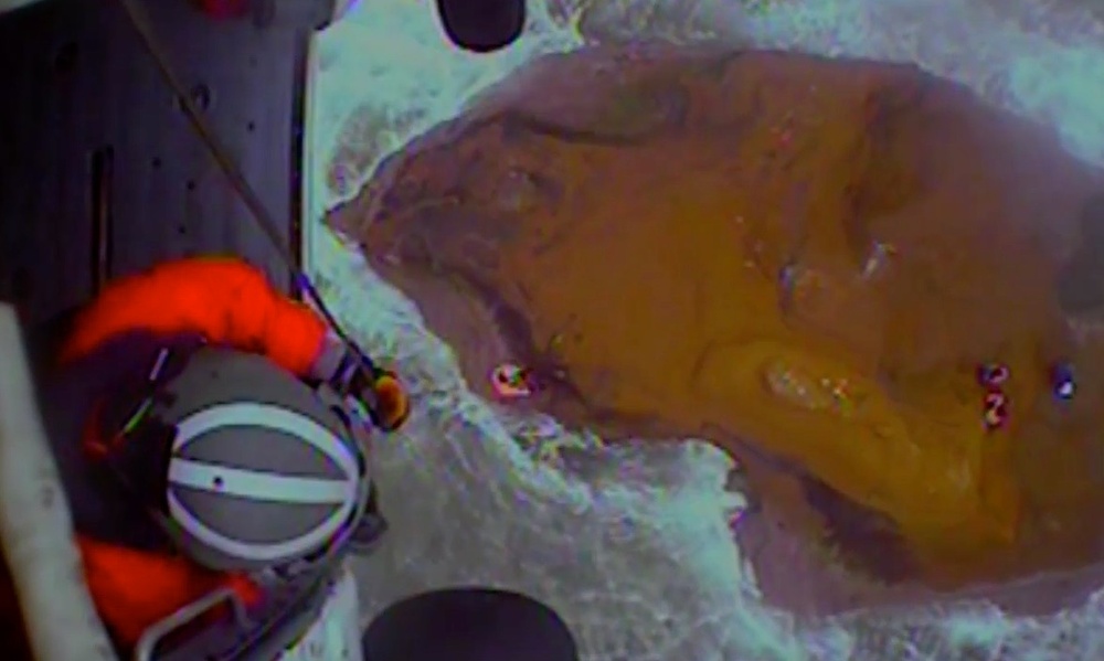 Coast Guard aircrew hoists 3 fishermen in Willapa Bay, Wash.