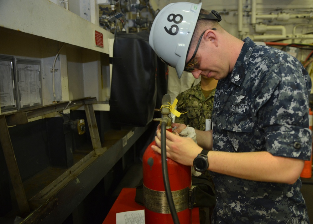 Sailor Cleans Fire Extinguisher