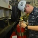 Sailor Cleans Fire Extinguisher