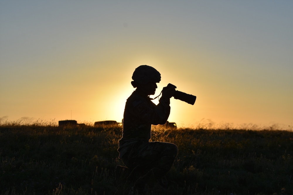 Army photographer in the morning sun