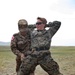 A Mongolian Armed Forces soldier searches U.S Marine Corps Sgt. Arielle Lahtinen.