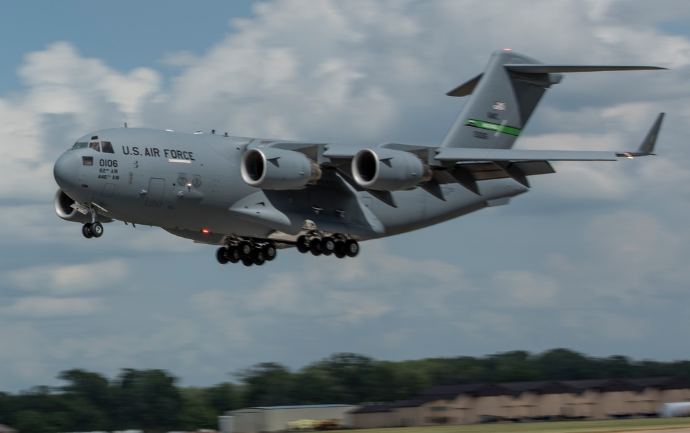 375th LRS Airmen unload C-17