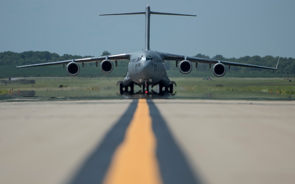 375th LRS Airmen unload C-17