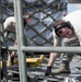 375th LRS Airmen unload C-17