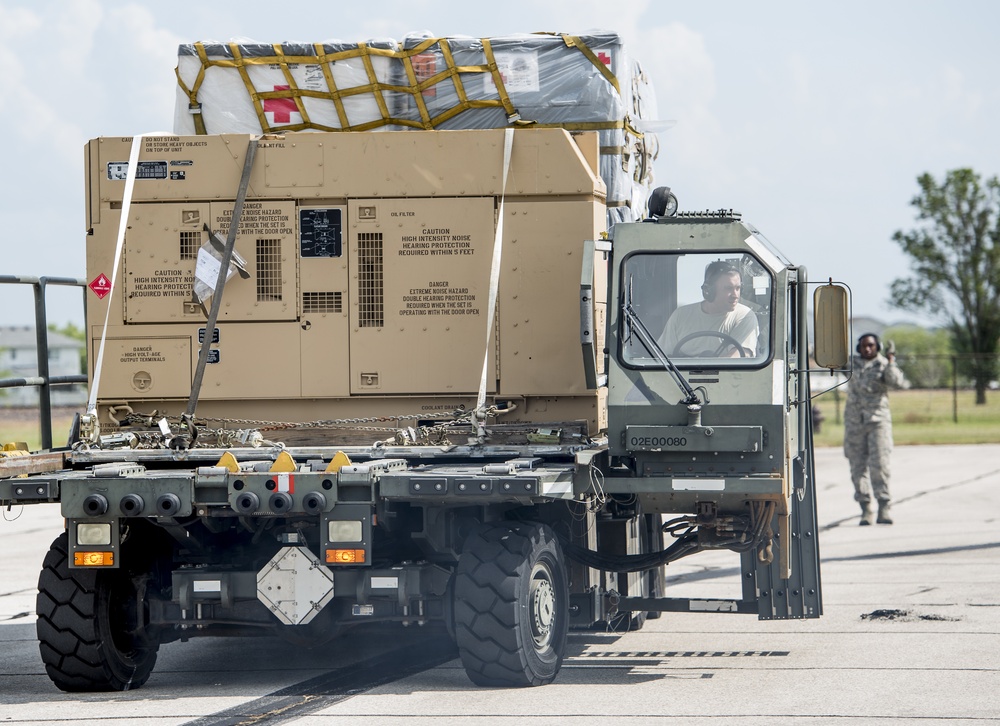 375th LRS Airmen unload C-17