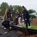 Sailors, community build playground for kids