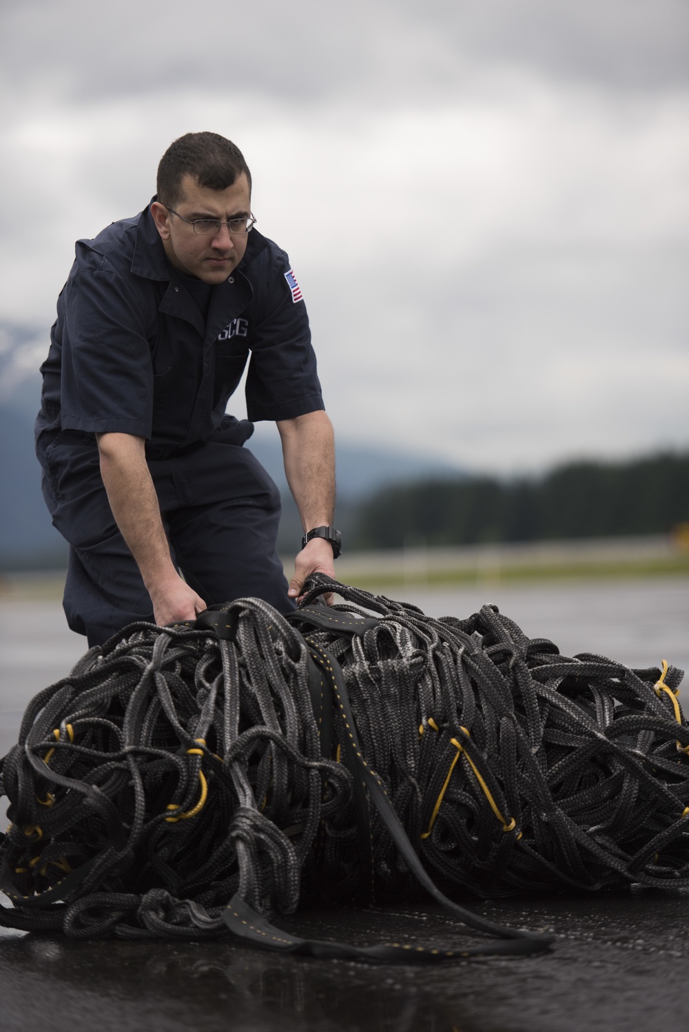 Coast Guard conducts oil spill containment boom helicopter deployment training in Juneau, Alaska