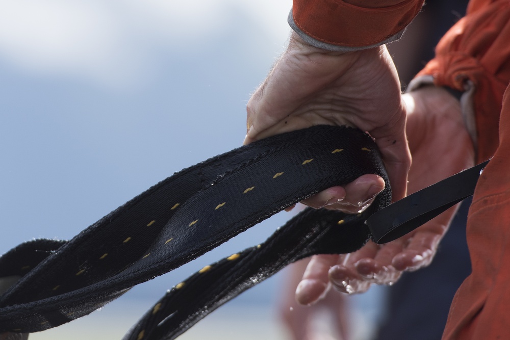 Coast Guard conducts oil spill containment boom helicopter deployment training in Juneau, Alaska