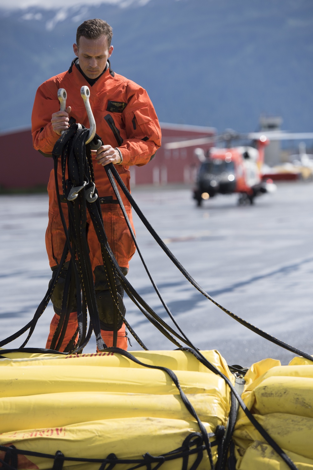 Coast Guard conducts oil containment boom helicopter deployment training in Juneau, Alaska