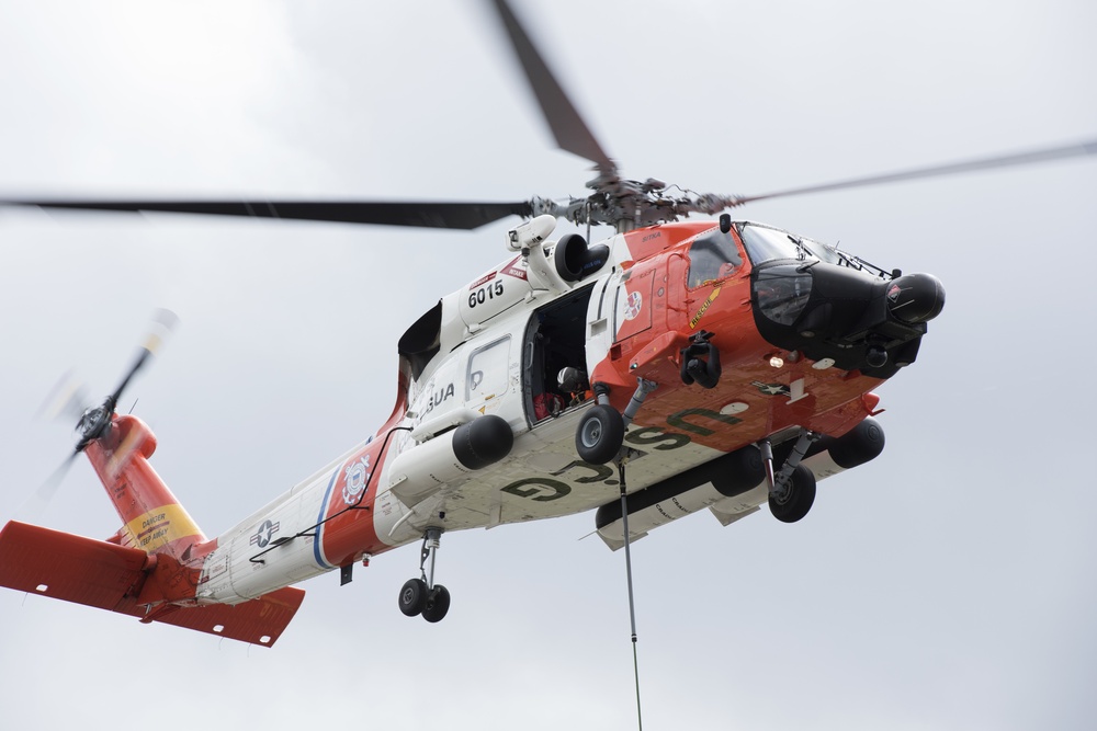 Coast Guard conducts oil containment boom helicopter deployment training in Juneau, Alaska