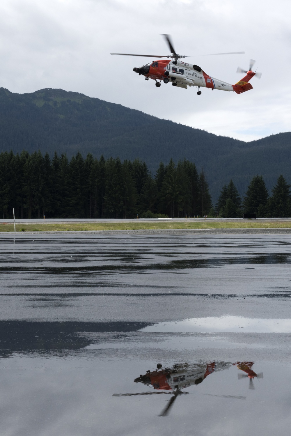 Coast Guard conducts oil containment boom helicopter deployment training in Juneau, Alaska