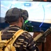 A Republic of Indonesia sailor experiences the Battlespace Exploitation Mixed Reality (BEMR Lab) GunnAR unified Gunner system with augmented reality during the RIMPAC 2018 Inaugural Innovation Fair