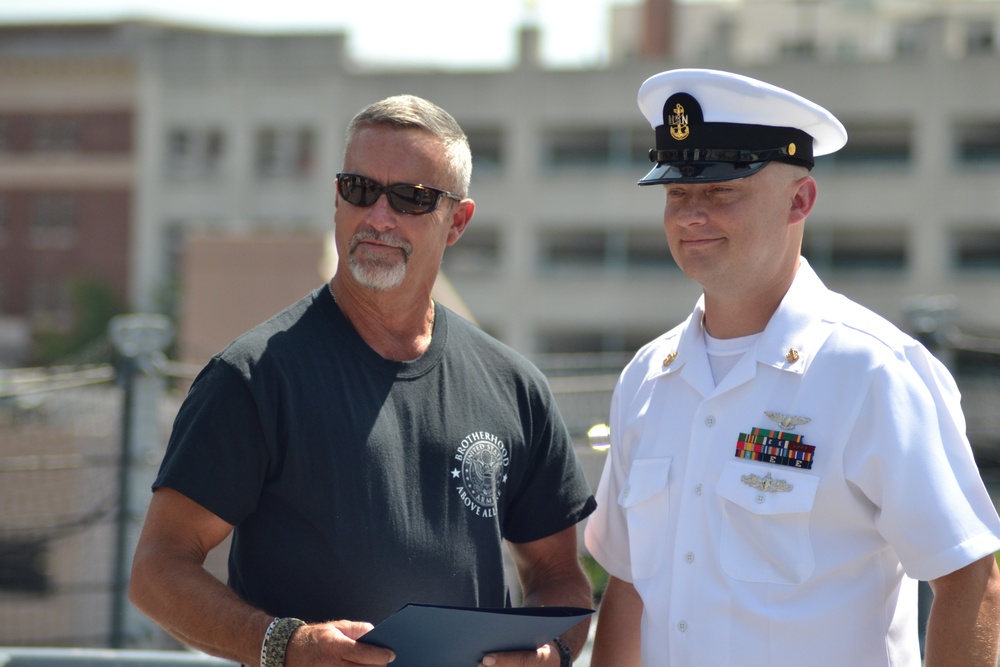 Family members receive certificates during Re-enlistment