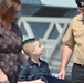 Family members receive certificates during re-enlistment