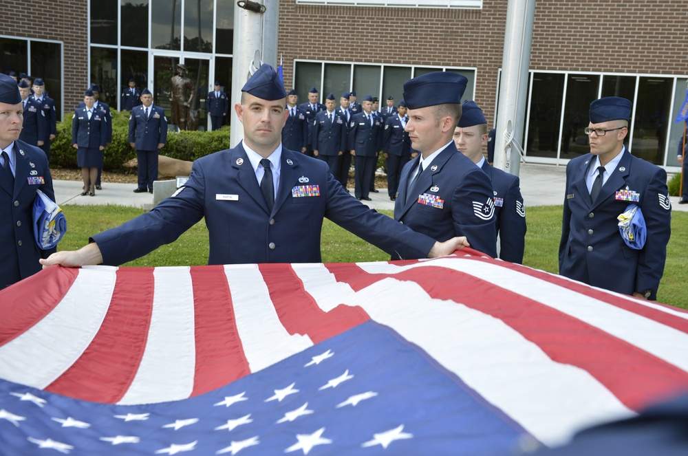 Airmen in NCOA class 13-6 participate in a retreat ceremony