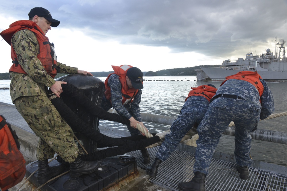 Sailors Secure Mooring Line