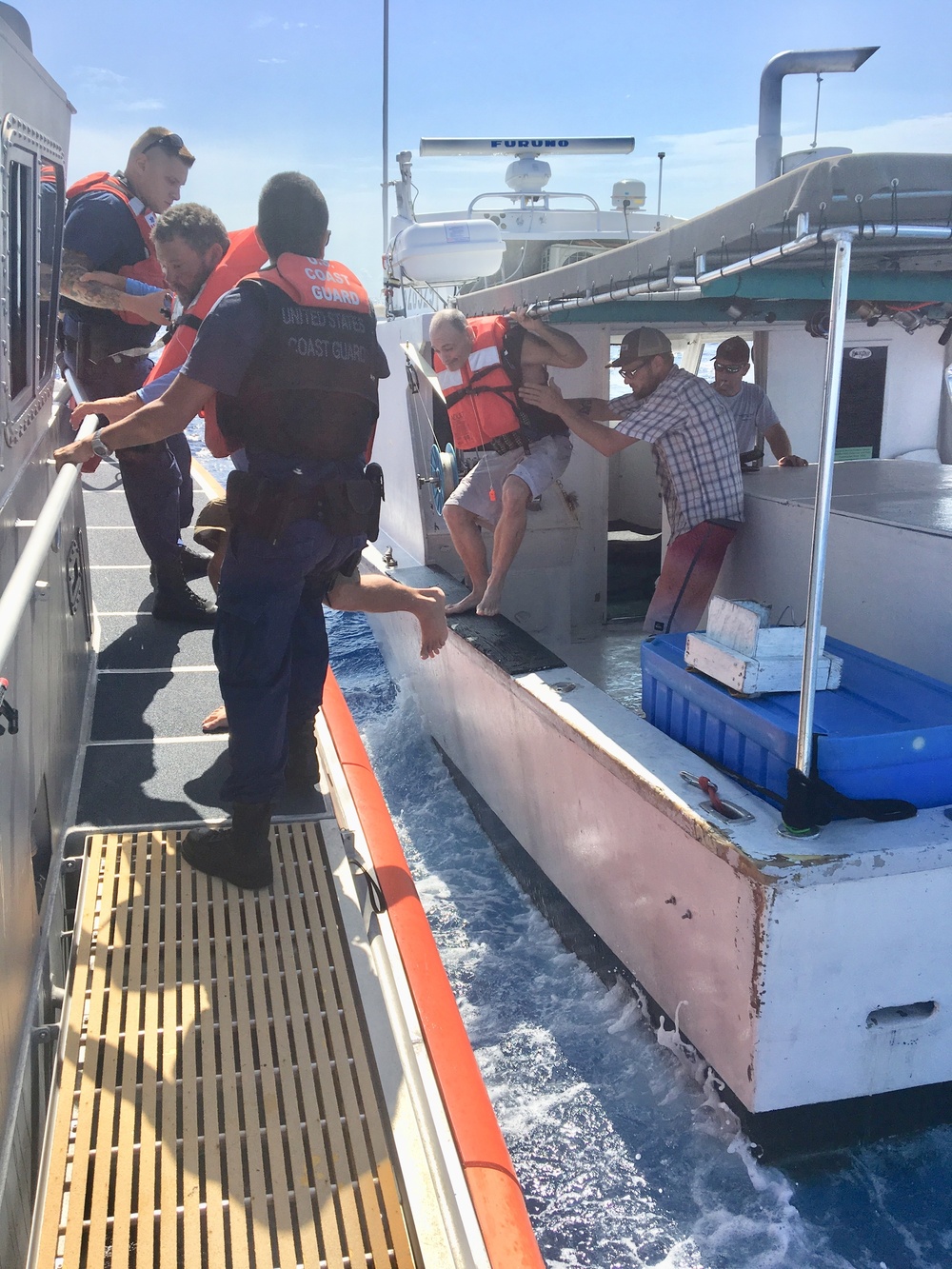 Coast Guard, good Samaritan rescue 2 after boat capsizes