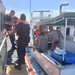 Coast Guard, good Samaritan rescue 2 after boat capsizes