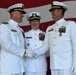 Two captains shake hands at a change of command ceremony
