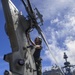 USS Antietam (CG 54) Sailor performs maintenance on a MH-60R Sea Hawk helicopter