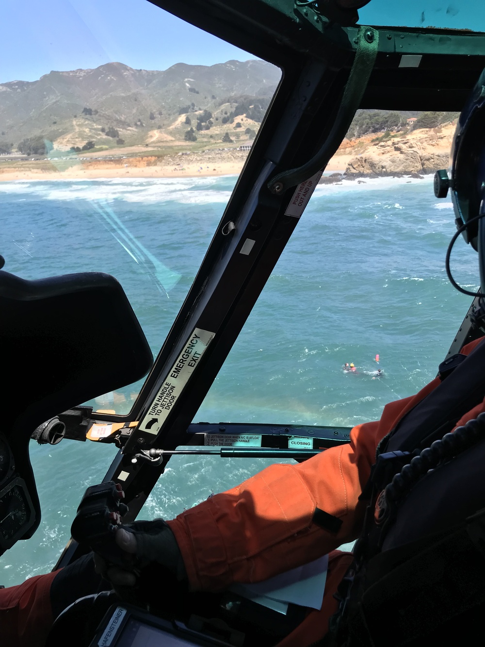 Coast Guard, lifeguard rescue surfer near Half Moon Bay