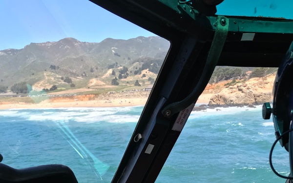 Coast Guard, lifeguard rescue surfer near Half Moon Bay