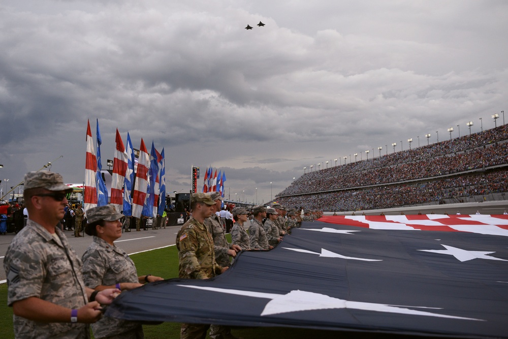 Airmen from 45th Space Wing, service members unfurl flag at Daytona Coke Zero Sugar 400