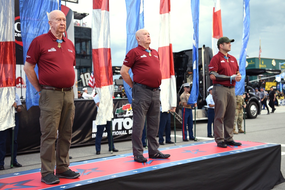 Airmen from 45th Space Wing, service members unfurl flag at Daytona Coke Zero Sugar 400