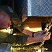 Coast Guard Pacific Strike team members and an Air Station Barbers point aircrew load decontamination gear for RIMPAC exercise