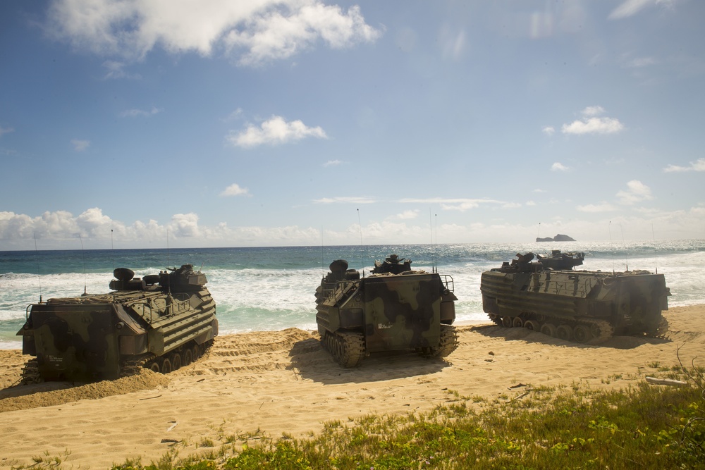 U.S. Marines with AAVs splash in RIMPAC