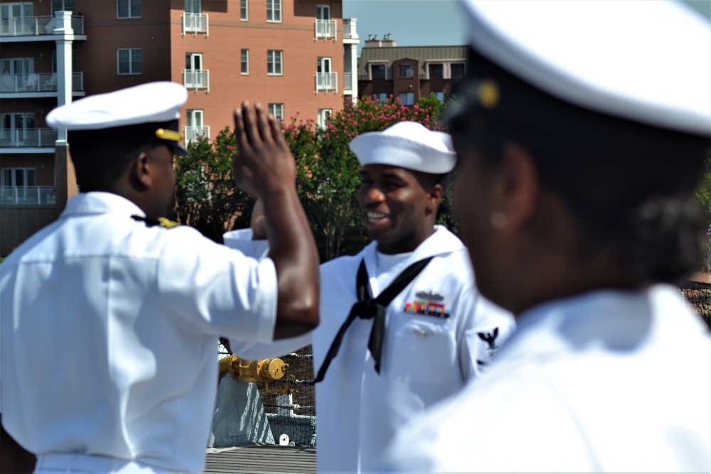 Raising right hand onboard a Battleship to re-enlist