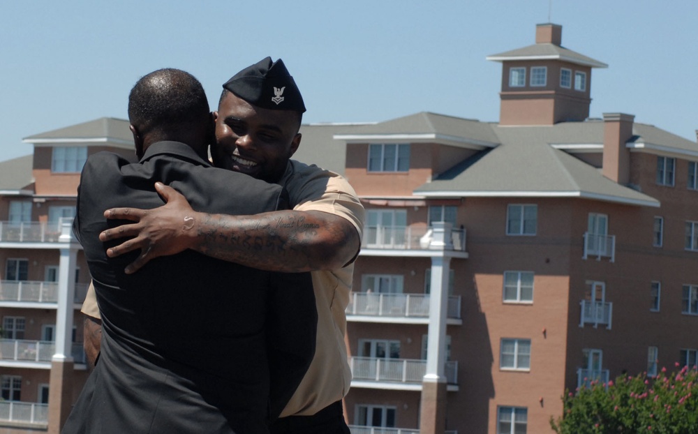 A hug after a historic re-enlistment