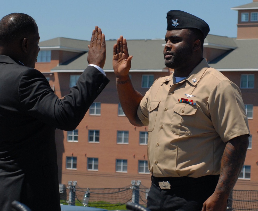 Retired U.S Army uncle re-enlists nephew into the U.S Navy