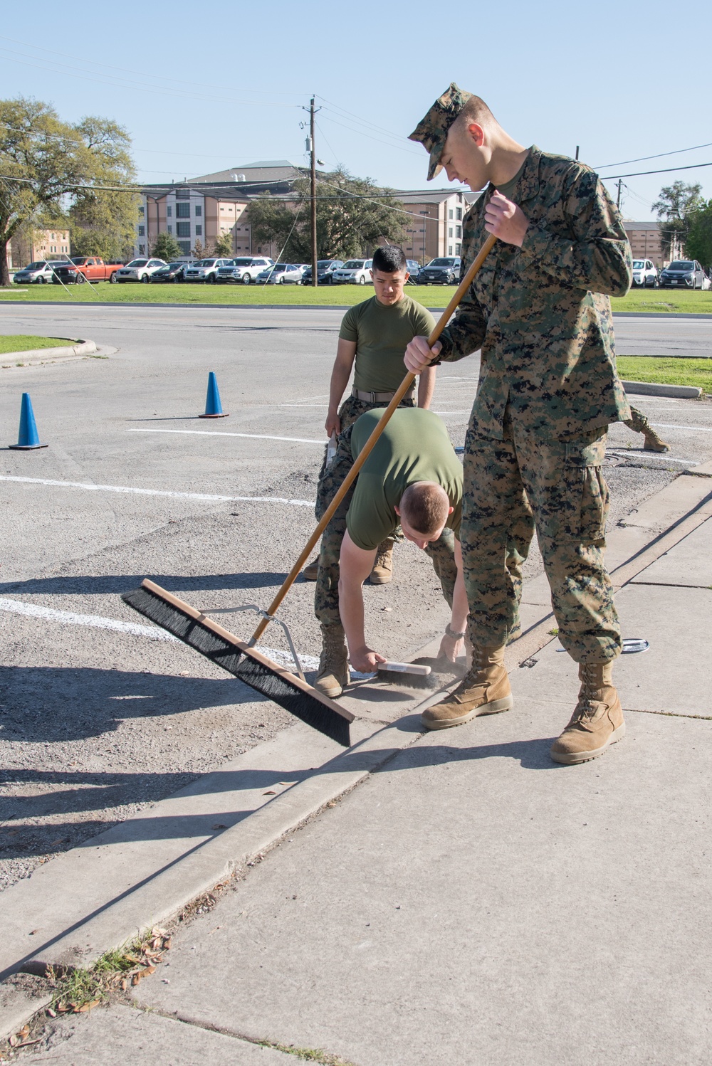 Marines cleaning parking lot at JBSA-Lackland