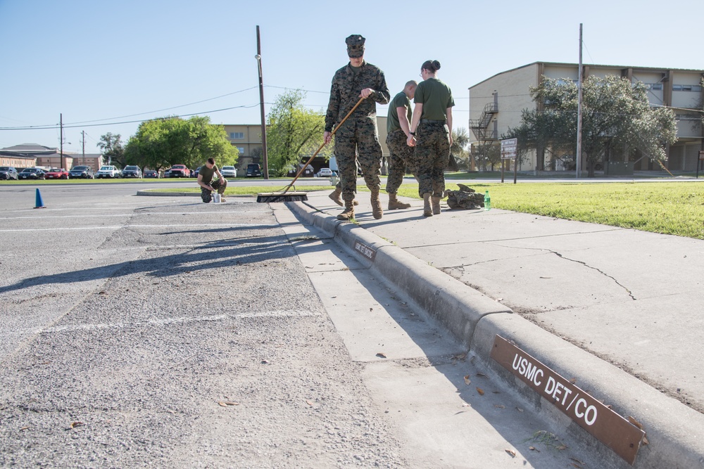 Marines cleaning parking lot at JBSA-Lackland