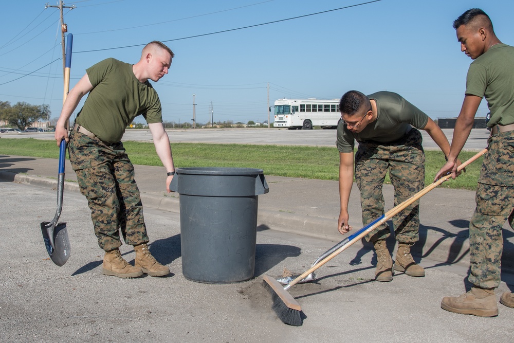 Marines cleaning parking lot at JBSA-Lackland