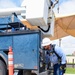 A 502nd Civil Engineer squadron high voltage team re-attaches the cover over Medina Base Gate