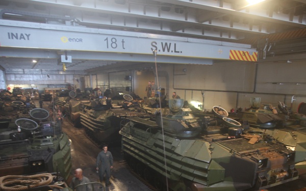 U.S. Marines embark onto the HMAS Adelaide during RIMPAC