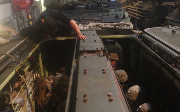 U.S. Marines practice loading onto AAV's aboard HMAS Adelaide during RIMPAC