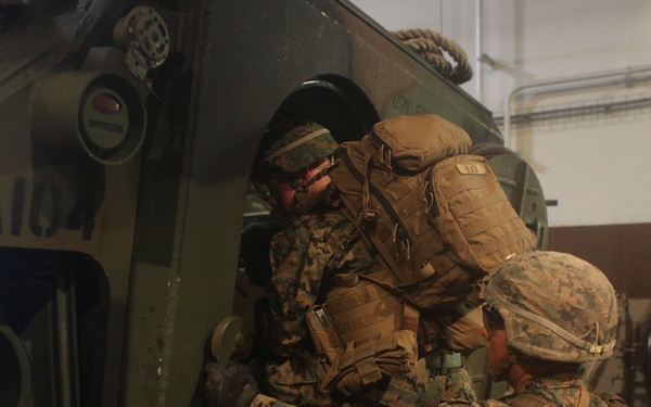 U.S. Marines practice loading onto AAV's aboard HMAS Adelaide during RIMPAC