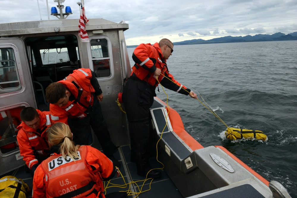 Coast Guard ANT Team conducts drop training with Air Station HC-130 Hercules aircrew