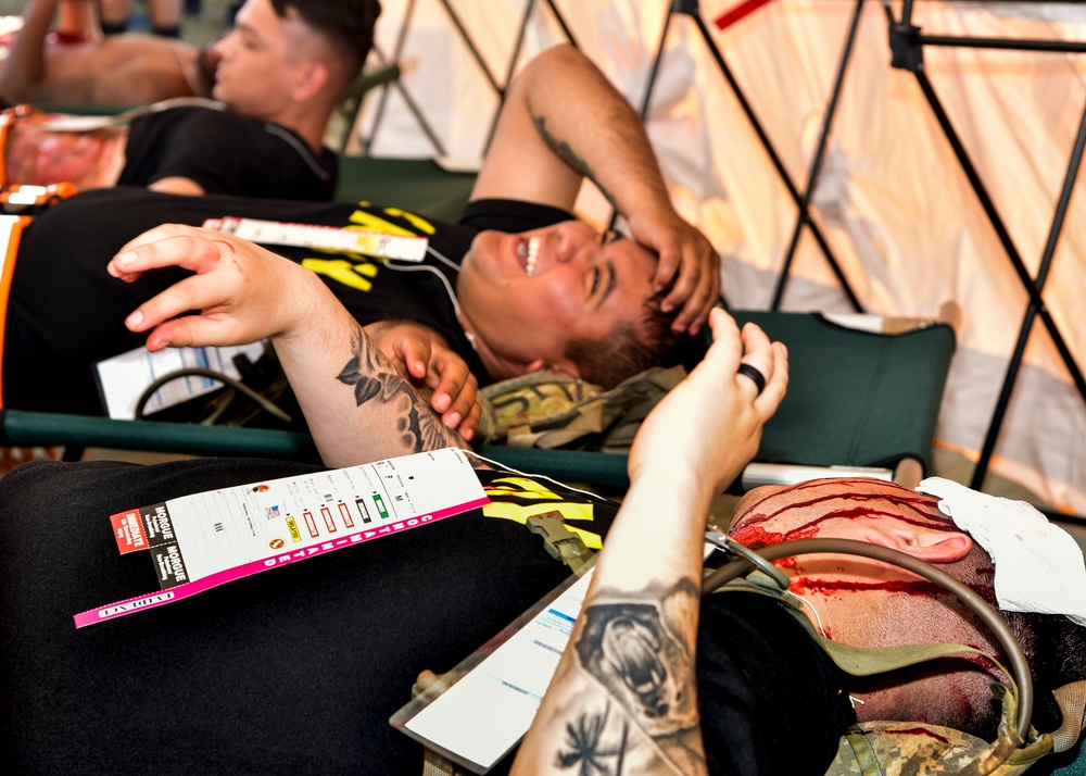 Soldiers simulate injuries during HADR Training during RIMPAC