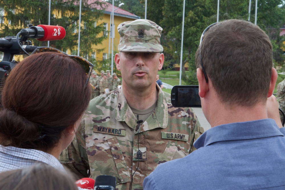 Command Sgt. Maj. Marc Maynard speaks with Ukrainian journalists