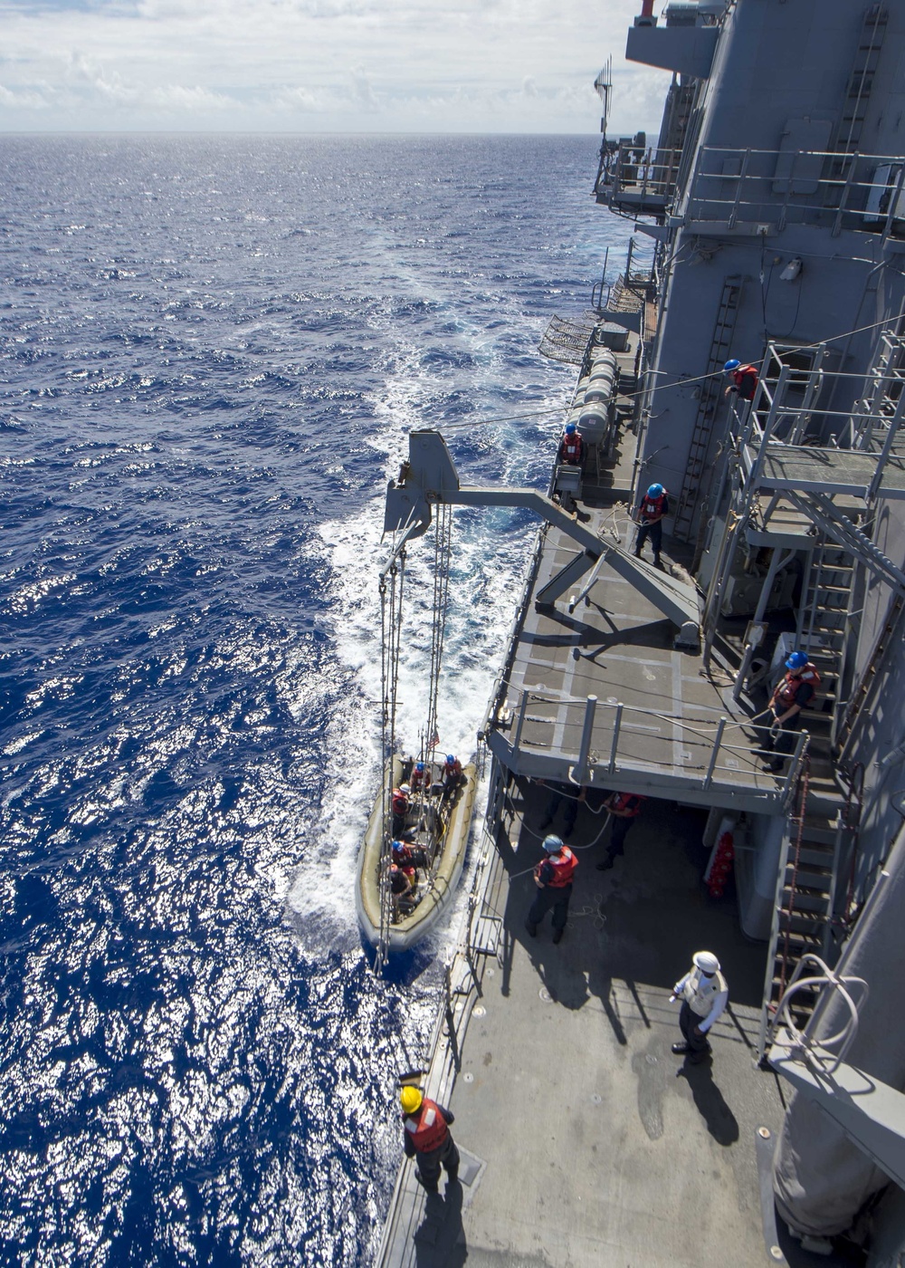Sailors assigned to USS Antietam (CG 54) prepare to hoist a rigid-hull inflatable boat (RHIB) during a training evolution