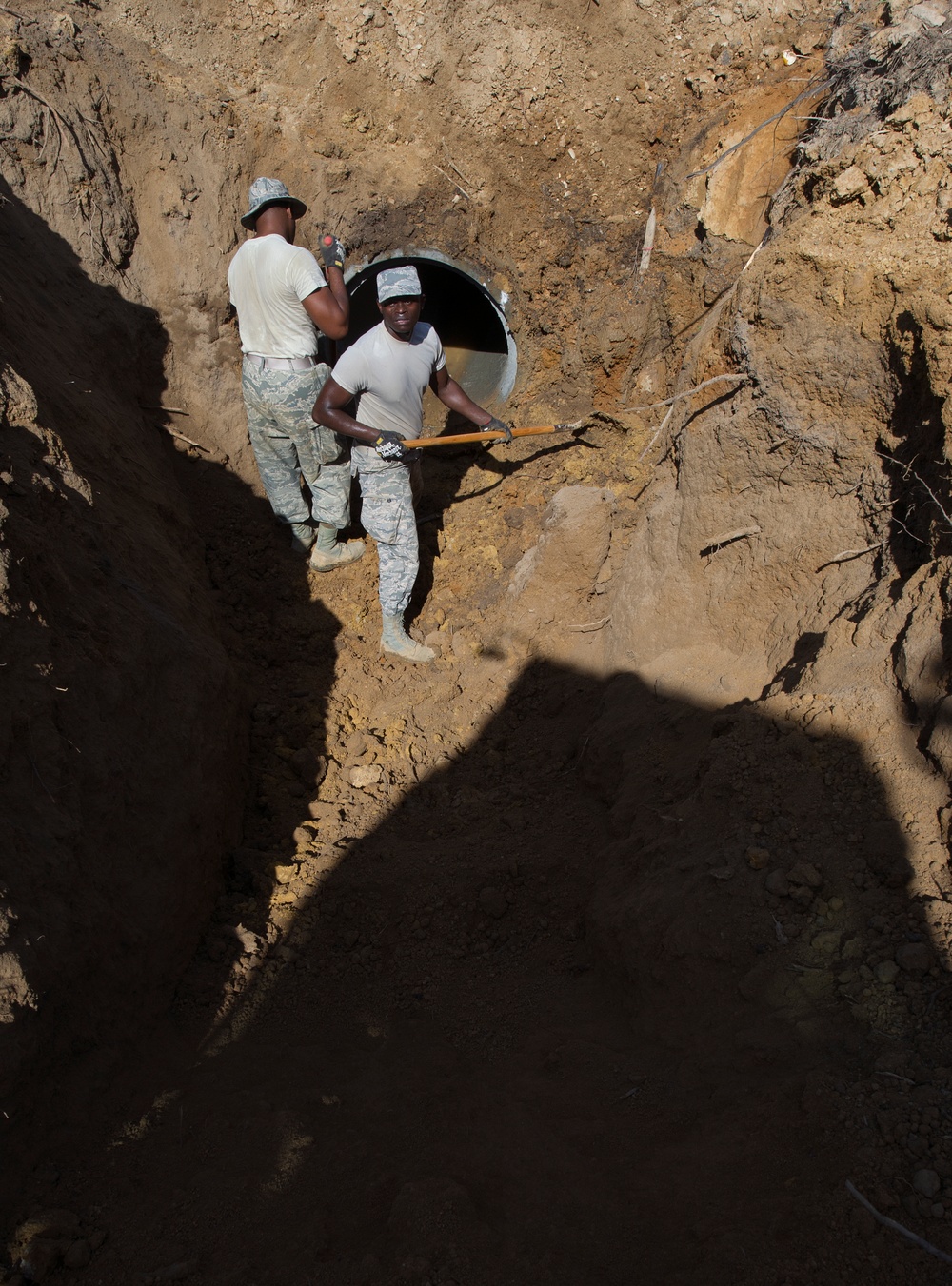 166th Civil Engineer Squadron install concrete storm water pipes for Camp Kamassa.