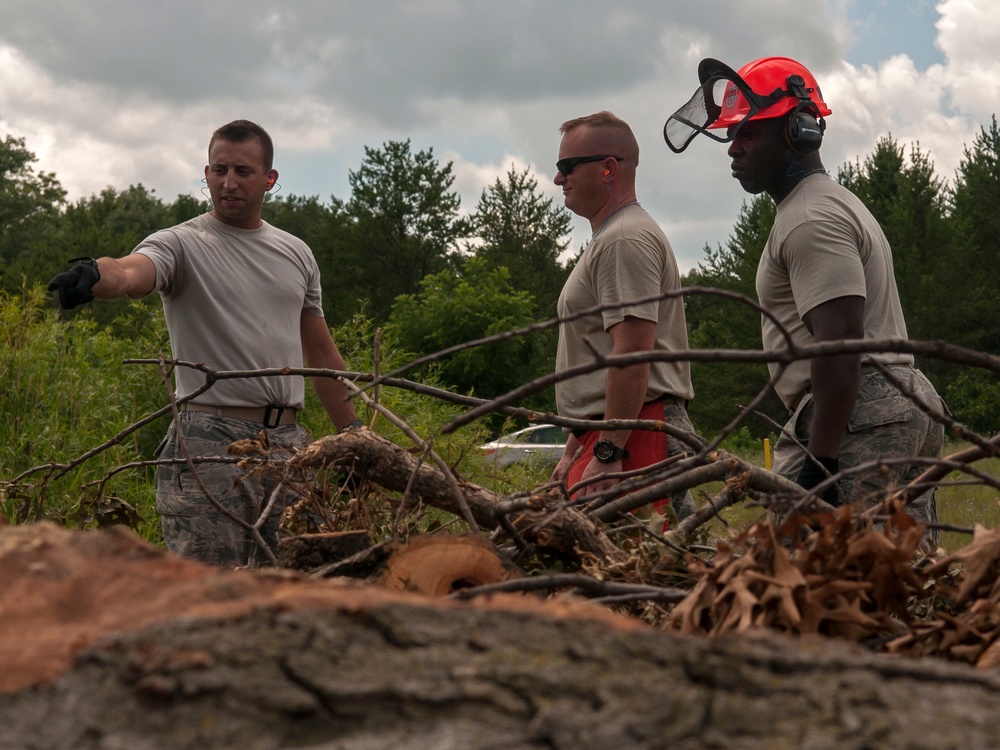 Civil Engineering Airmen clear debris from roadway during PATRIOT exercise