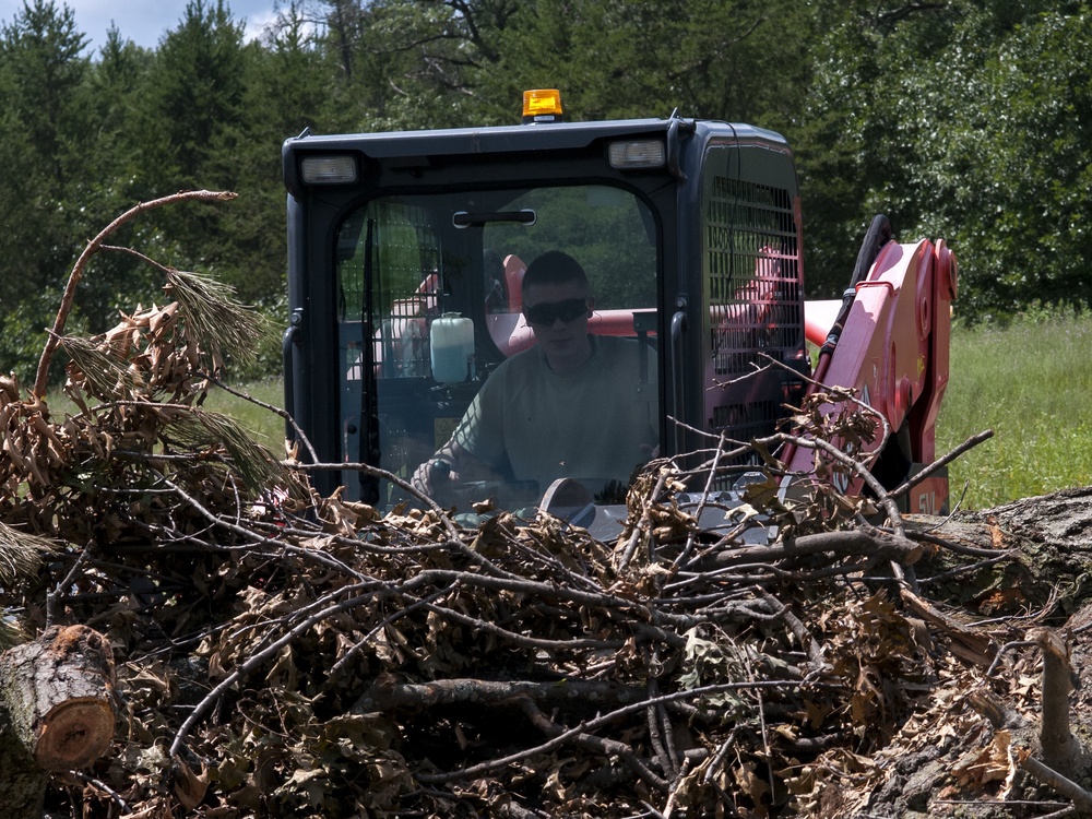 Civil Engineering Airmen clear debris from roadway during PATRIOT exercise