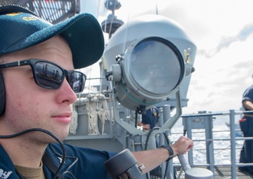 USS Antietam (CG 54) Sailor stands watch during a replenishment at sea with USNS Walter S. Diehl (T-AO-193)
