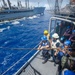 Sailors assigned to USS Antietam (CG 54) prepare to receive fuel from USNS Walter S. Diehl (T-AO-193)
